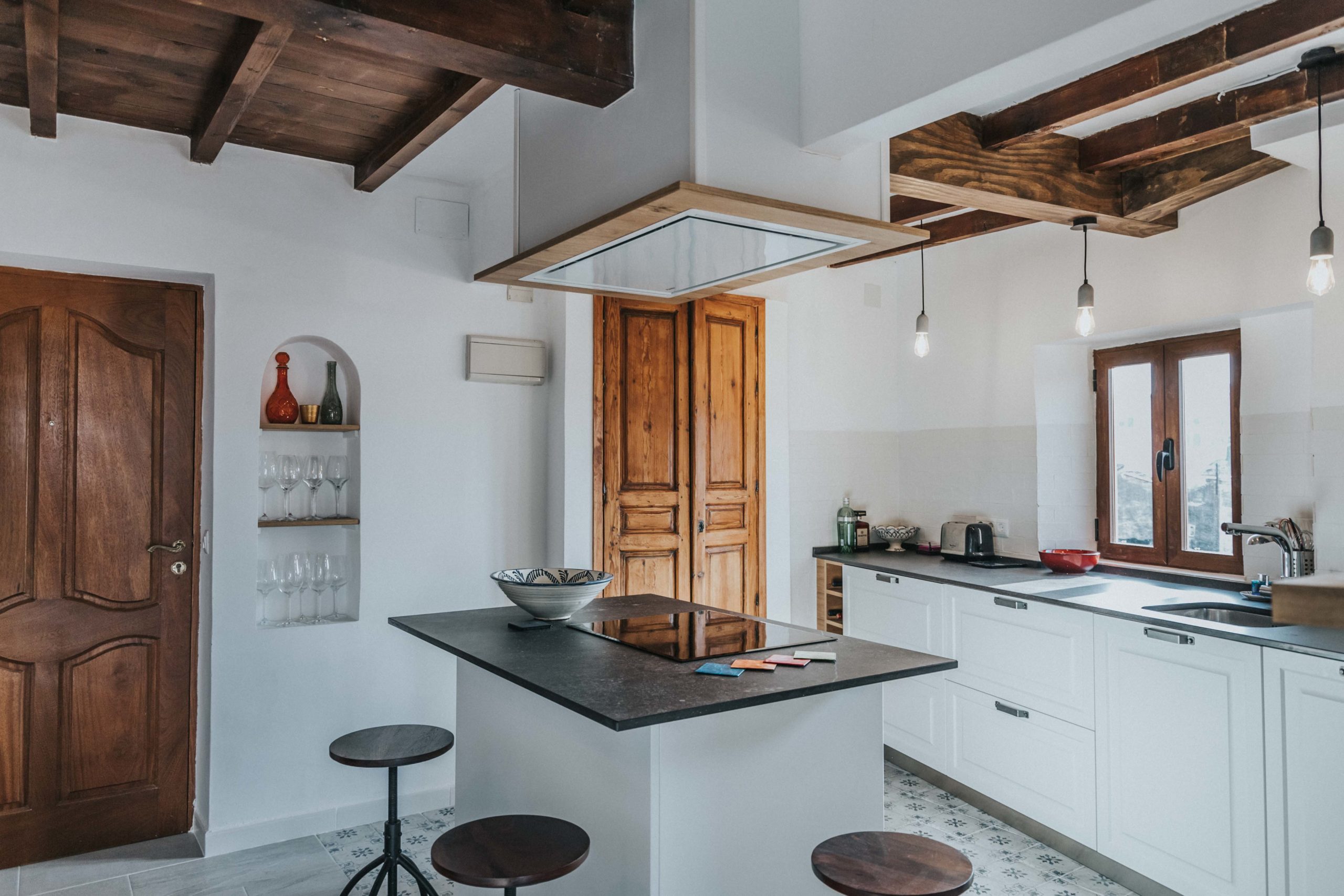 White and wood kitchen in a penthouse