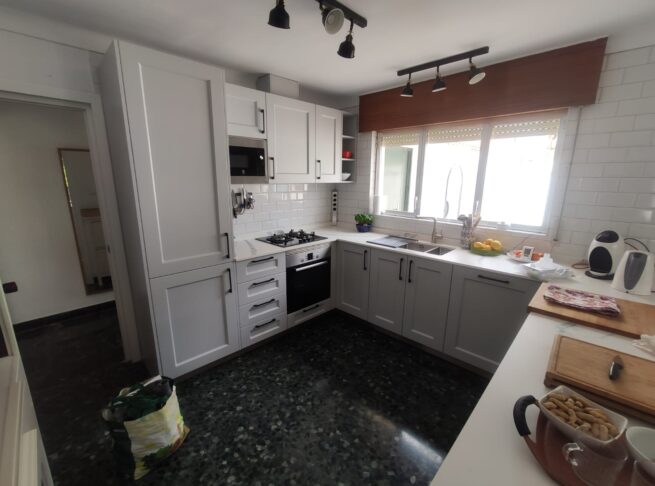 Kitchen with wooden island and earthy color